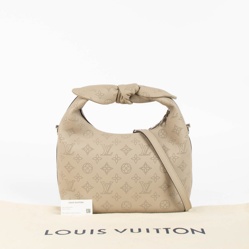 Shop this 100% authentic Louis Vuitton Tourterelle Why Knot Bag at Labellov.com