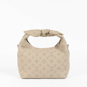 Shop this 100% authentic Louis Vuitton Tourterelle Why Knot Bag at Labellov.com