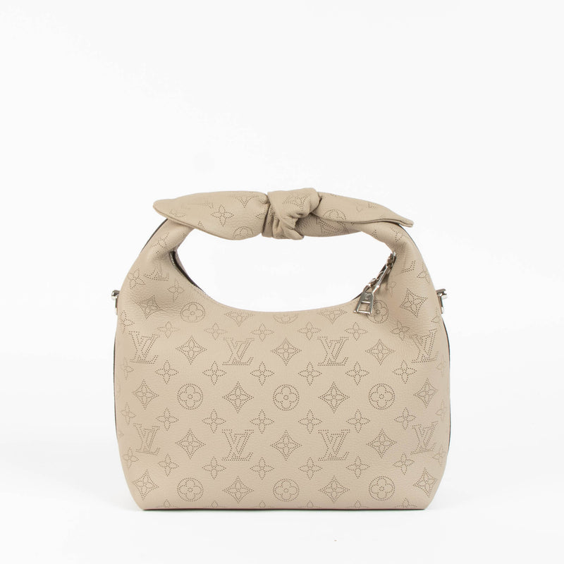 Shop this 100% authentic Louis Vuitton Tourterelle Why Knot Bag at Labellov.com