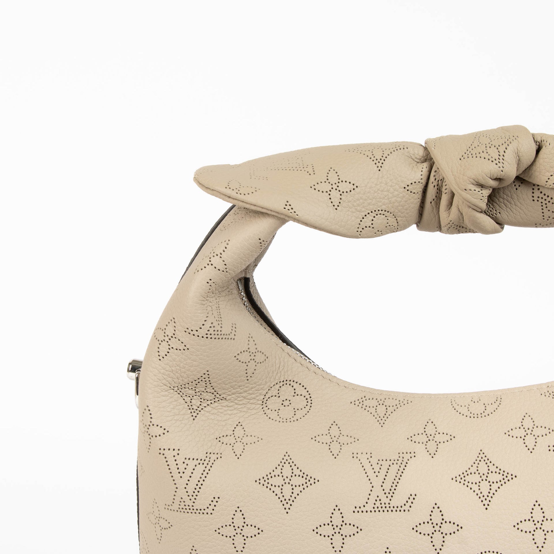 Shop this 100% authentic Louis Vuitton Tourterelle Why Knot Bag at Labellov.com