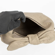 Shop this 100% authentic Louis Vuitton Tourterelle Why Knot Bag at Labellov.com