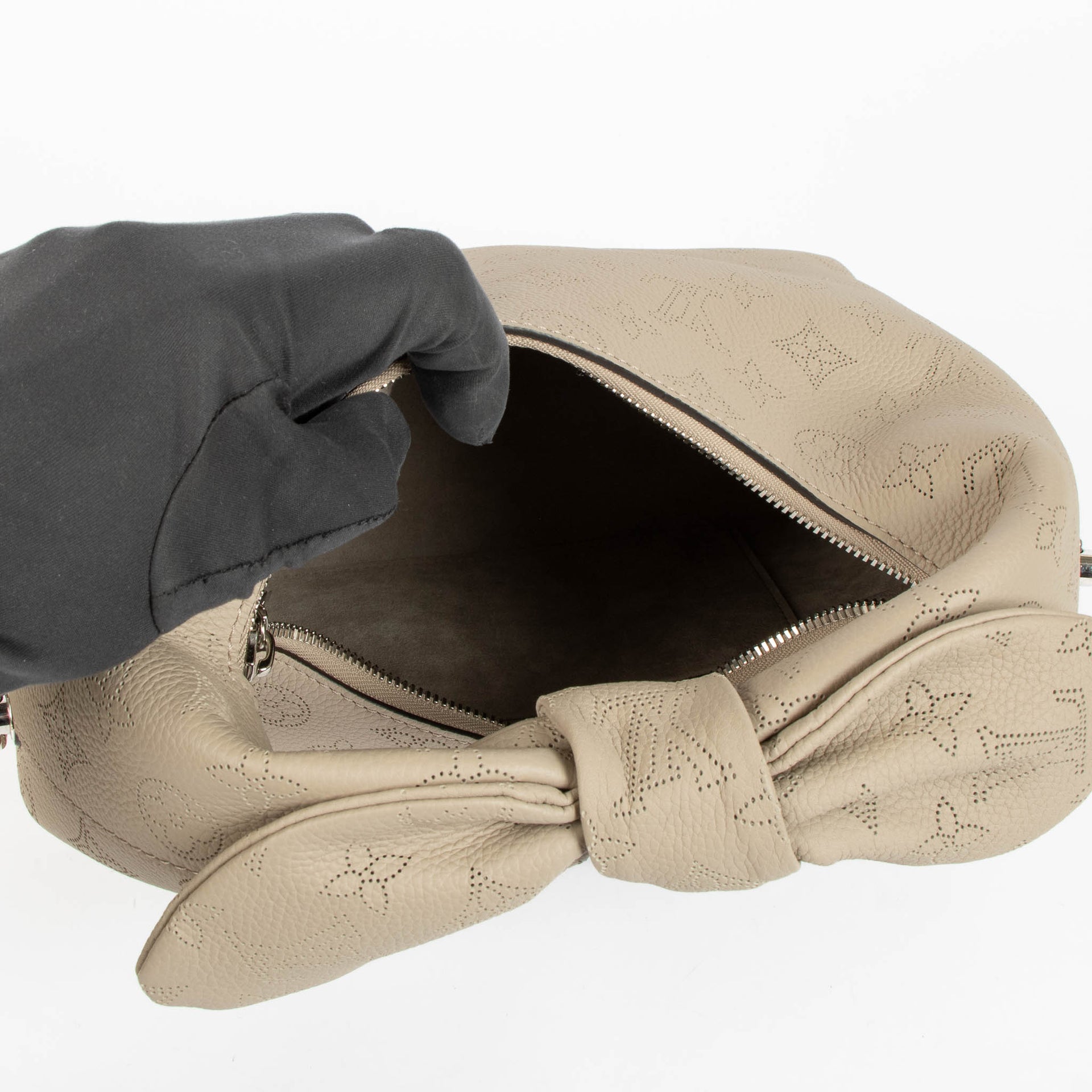 Shop this 100% authentic Louis Vuitton Tourterelle Why Knot Bag at Labellov.com