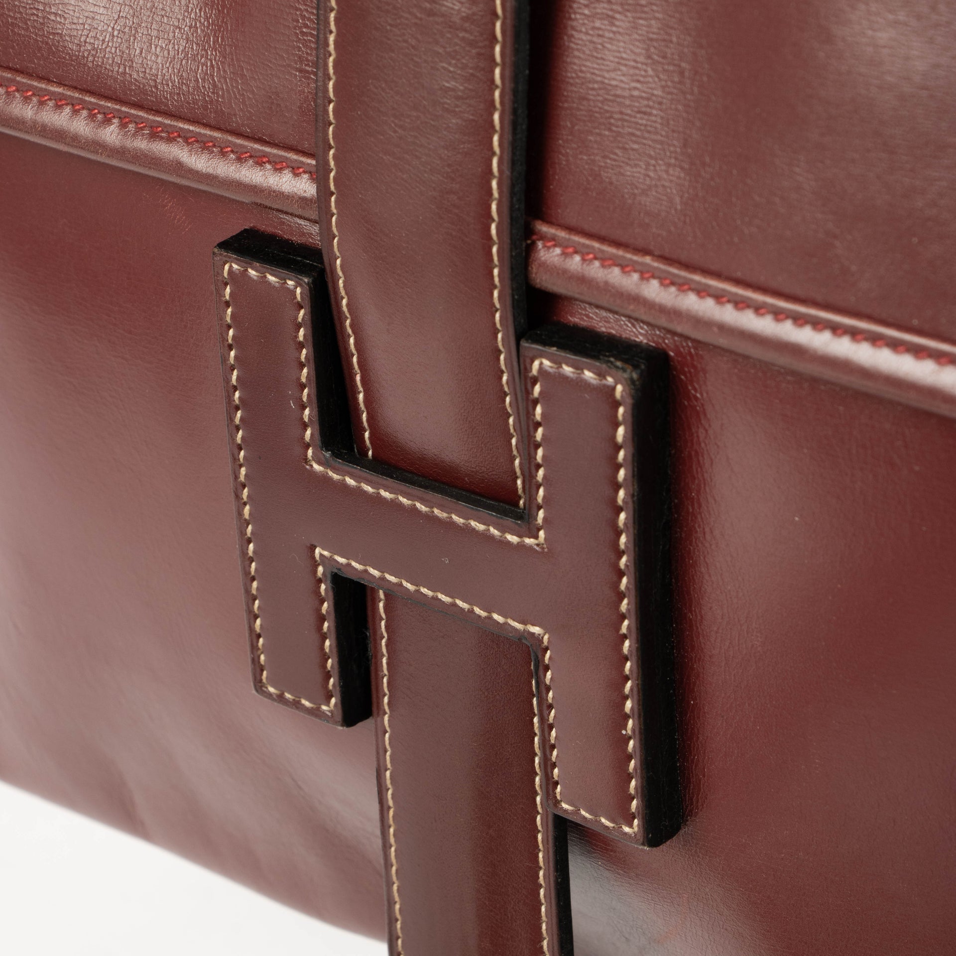 Pochette Hermès Jige PM en cuir Box Bordeaux