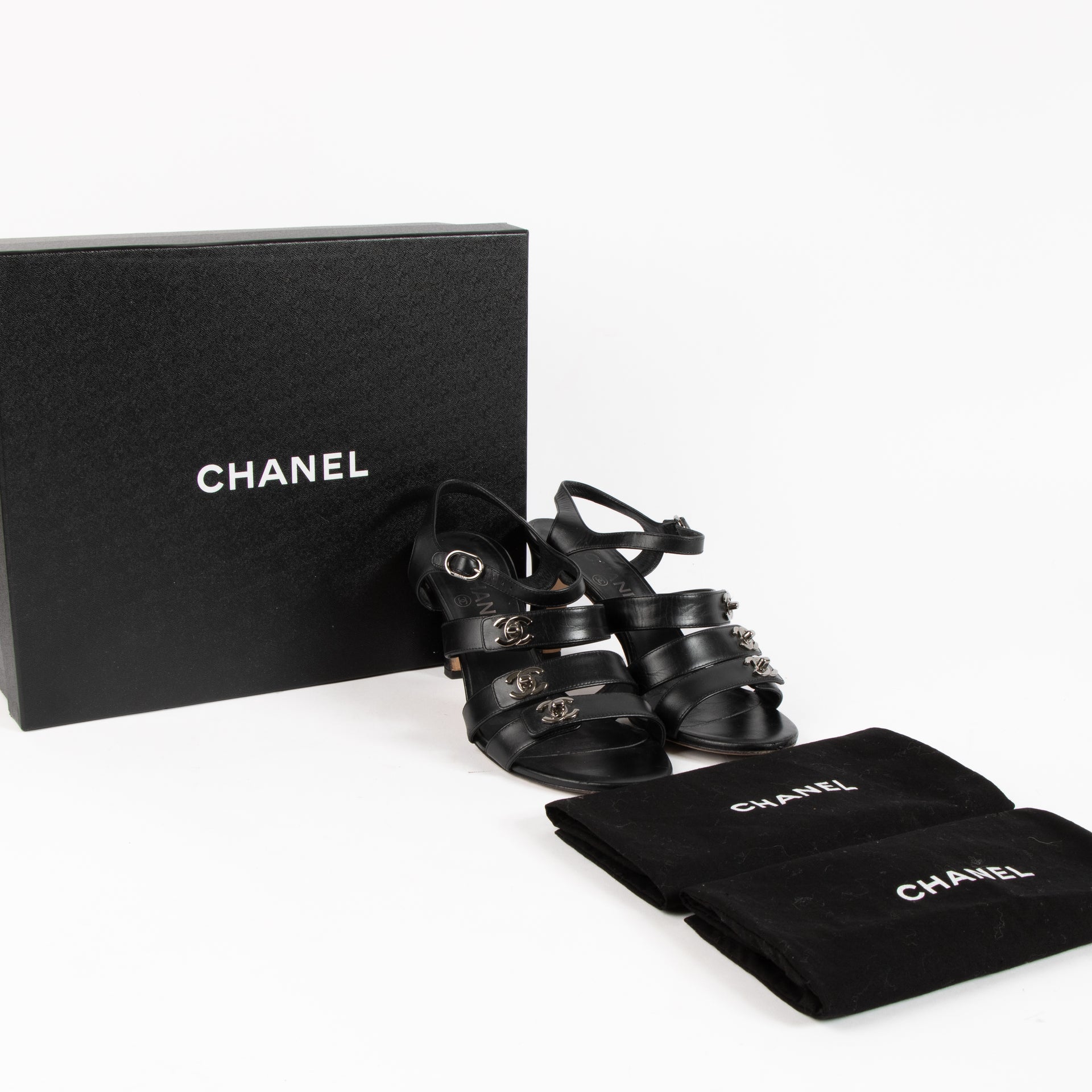 Chanel Black CC Turnlock Strappy Heels - Size 38,5