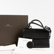 Shop the 100% authentic Delvaux All Black Calf Souple Tempête Mini Bag second hand on Labellov.com!