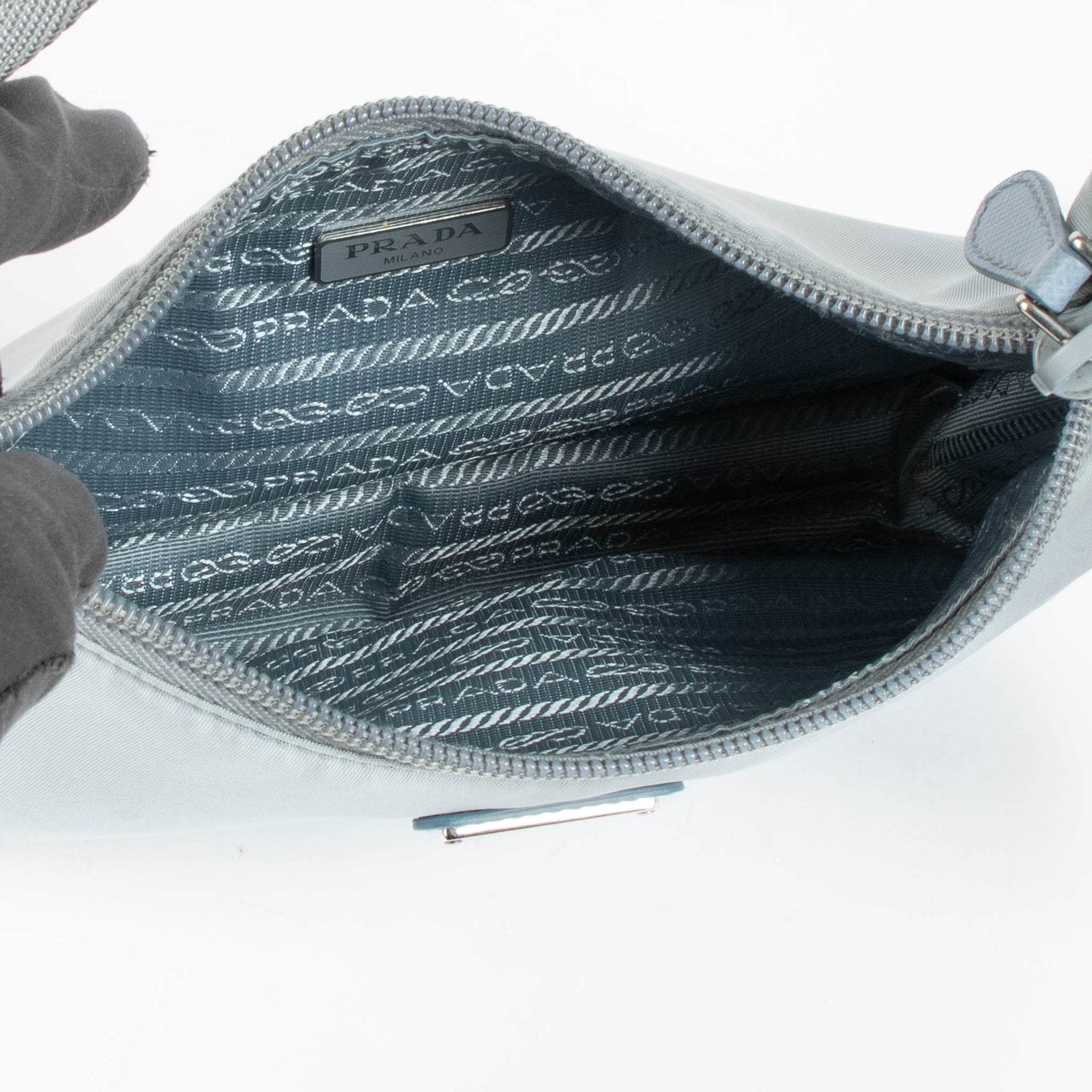 Shop this authentic Prada Blue Shoulder Re-Edition bag pre-loved on Labellov.com 