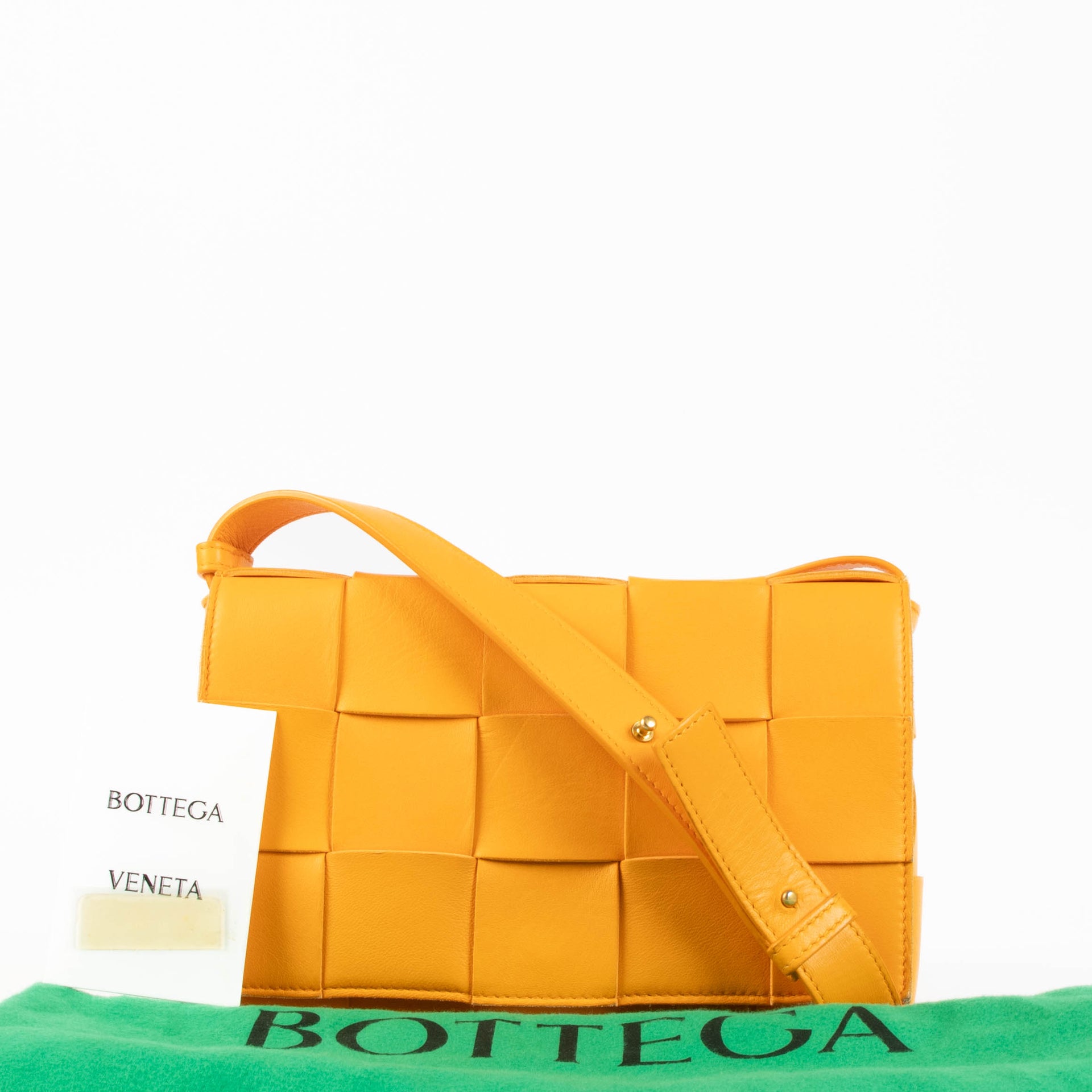 Shop the authentic Bottega Veneta Tangerine Cassette Crossbody Bag second hand on Labellov.com