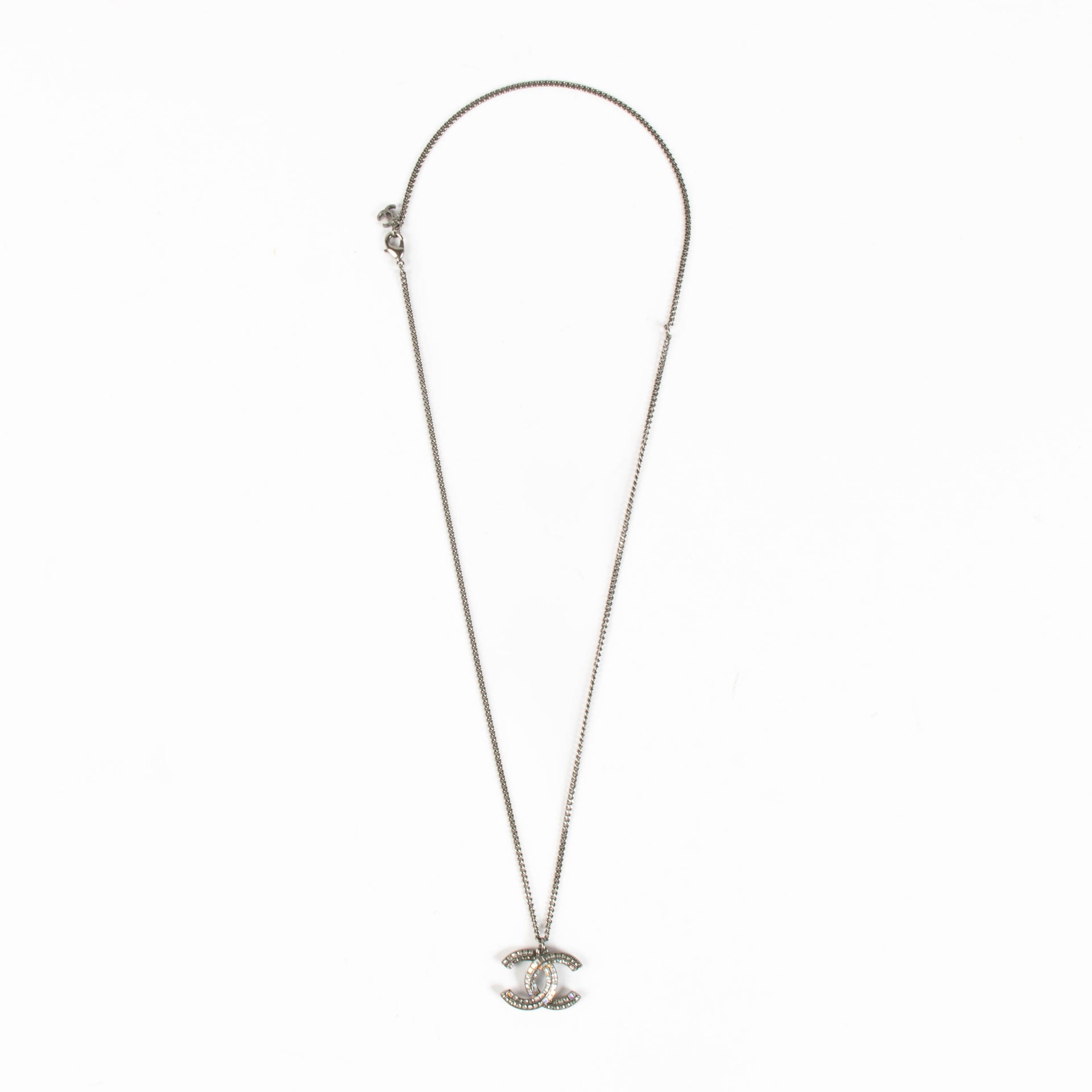 Shop the authentic Chanel Silver 15P Crystal CC Necklace second hand on Labellov.com