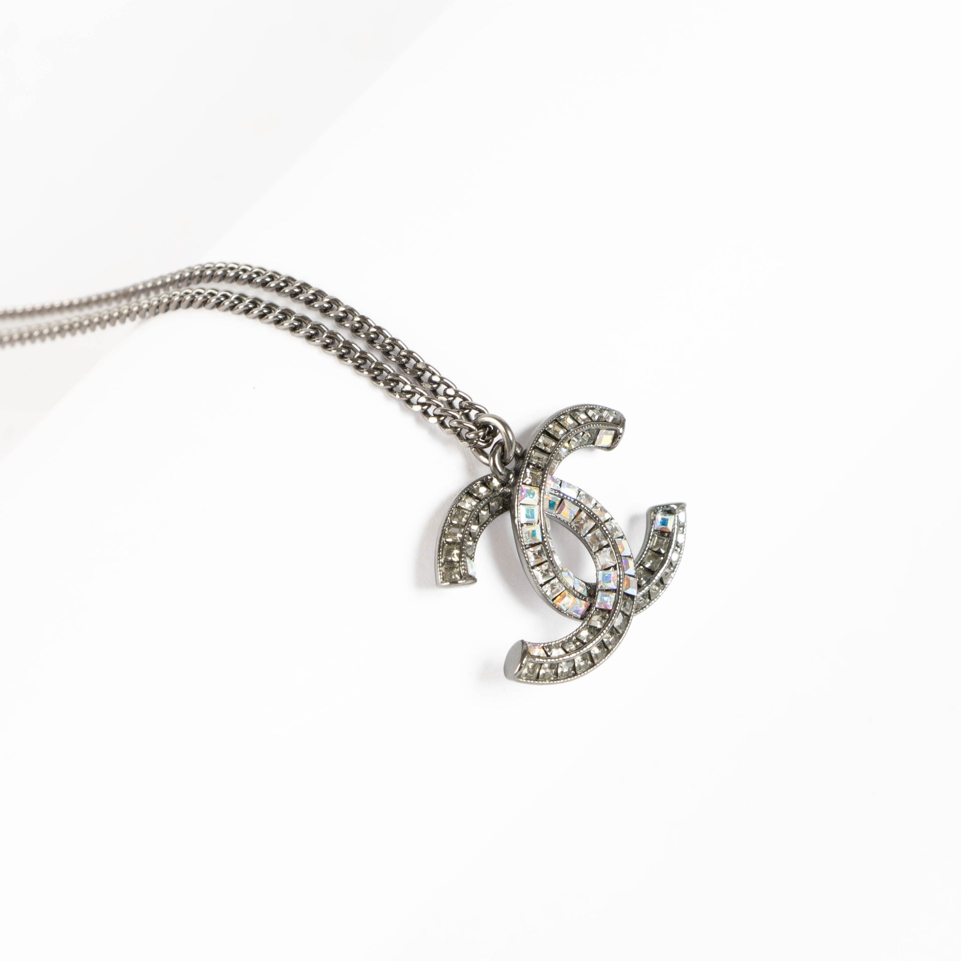 Shop the authentic Chanel Silver 15P Crystal CC Necklace second hand on Labellov.com