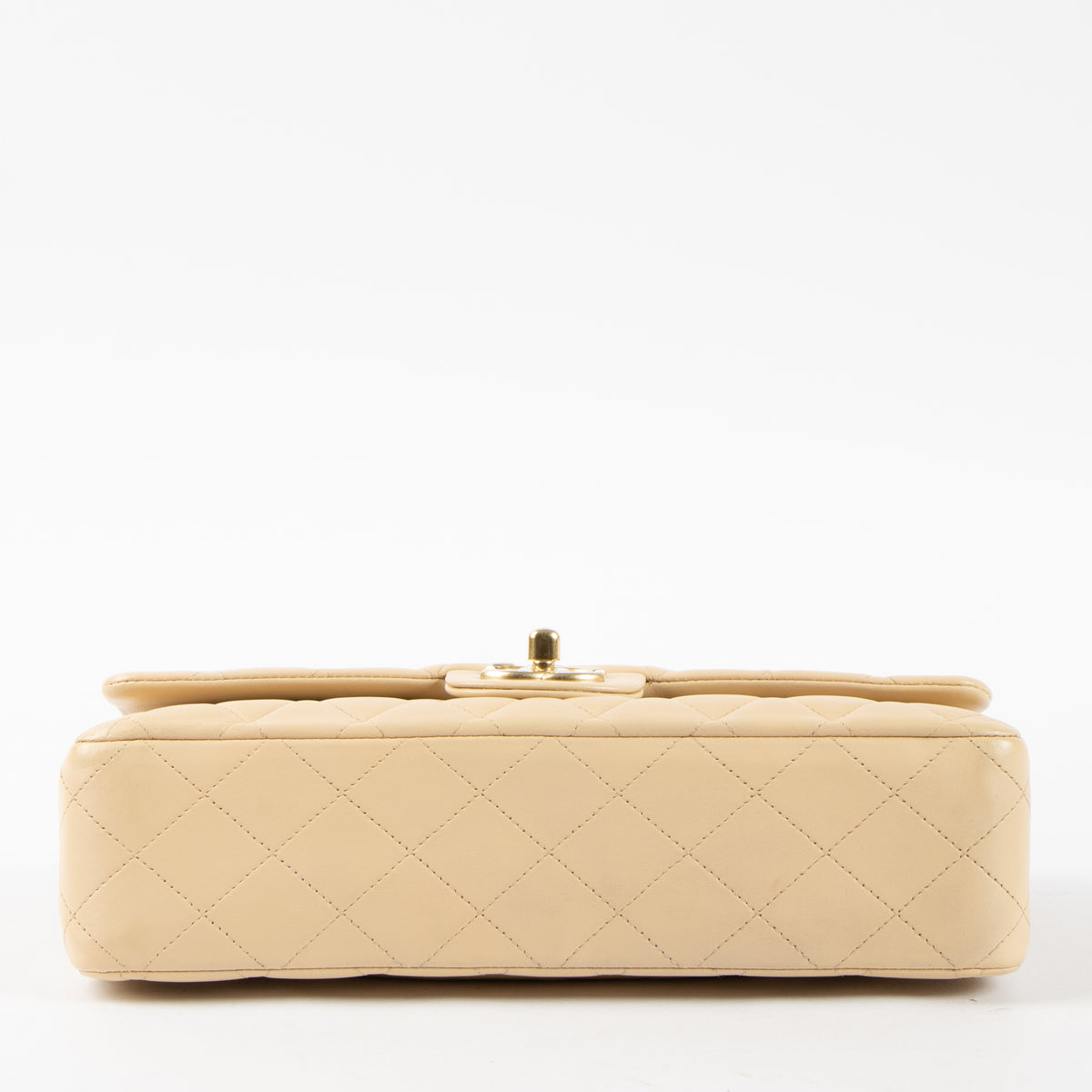Shop this authentic Chanel Beige Lambskin Medium Classic 11.12 Handbag Pre-Loved on Labellov.com