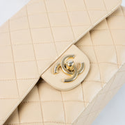 Shop this authentic Chanel Beige Lambskin Medium Classic 11.12 Handbag Pre-Loved on Labellov.com