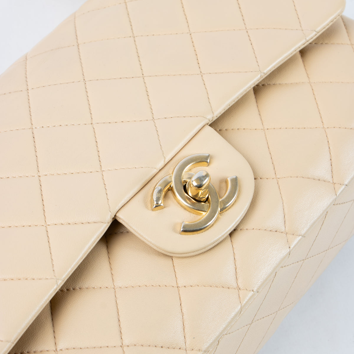 Shop this authentic Chanel Beige Lambskin Medium Classic 11.12 Handbag Pre-Loved on Labellov.com