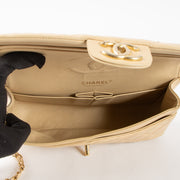 Shop this authentic Chanel Beige Lambskin Medium Classic 11.12 Handbag Pre-Loved on Labellov.com