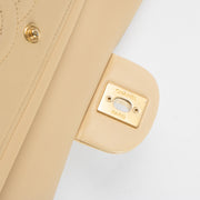 Shop this authentic Chanel Beige Lambskin Medium Classic 11.12 Handbag Pre-Loved on Labellov.com