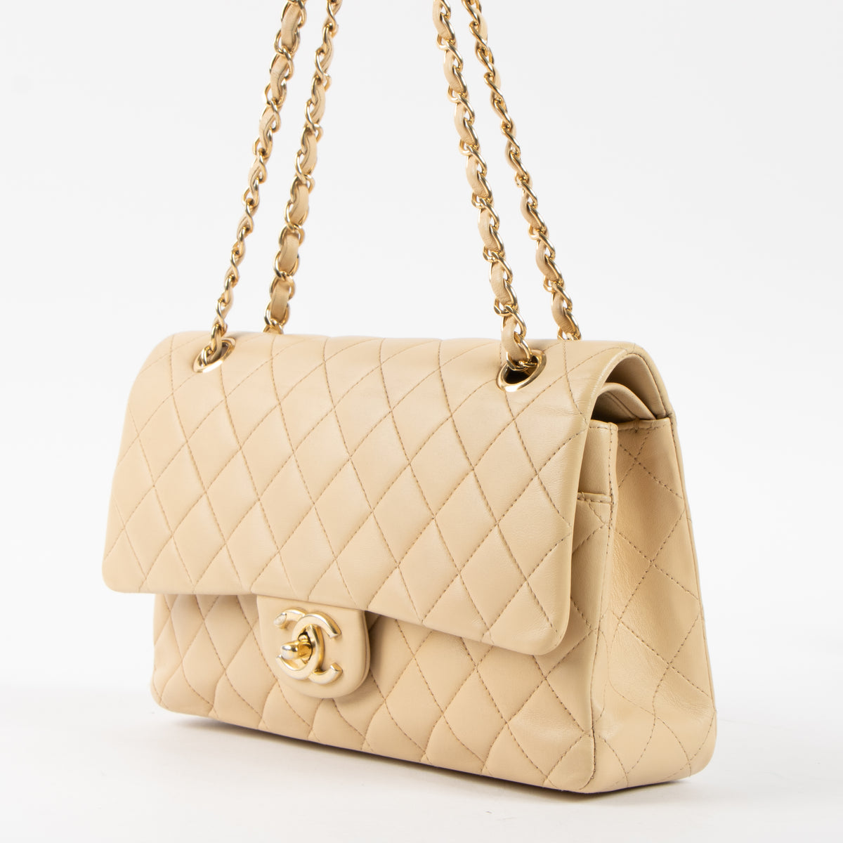 Shop this authentic Chanel Beige Lambskin Medium Classic 11.12 Handbag Pre-Loved on Labellov.com