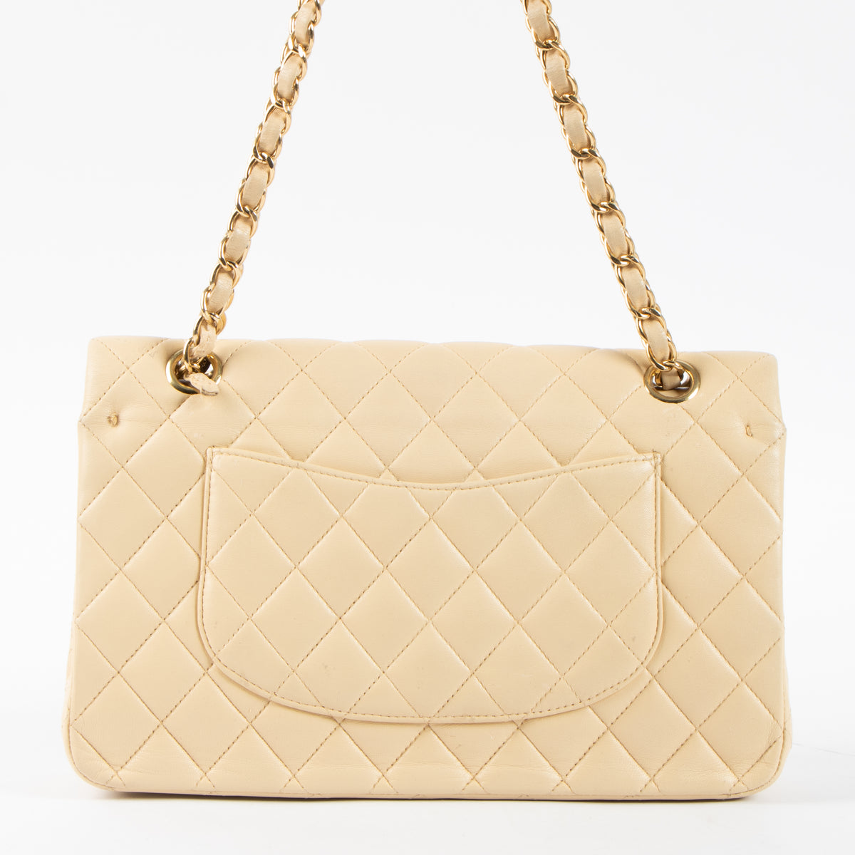 Shop this authentic Chanel Beige Lambskin Medium Classic 11.12 Handbag pre-loved on Labellov.com