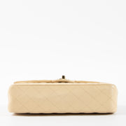 Shop this authentic Chanel Beige Lambskin Medium Classic 11.12 Handbag pre-loved on Labellov.com