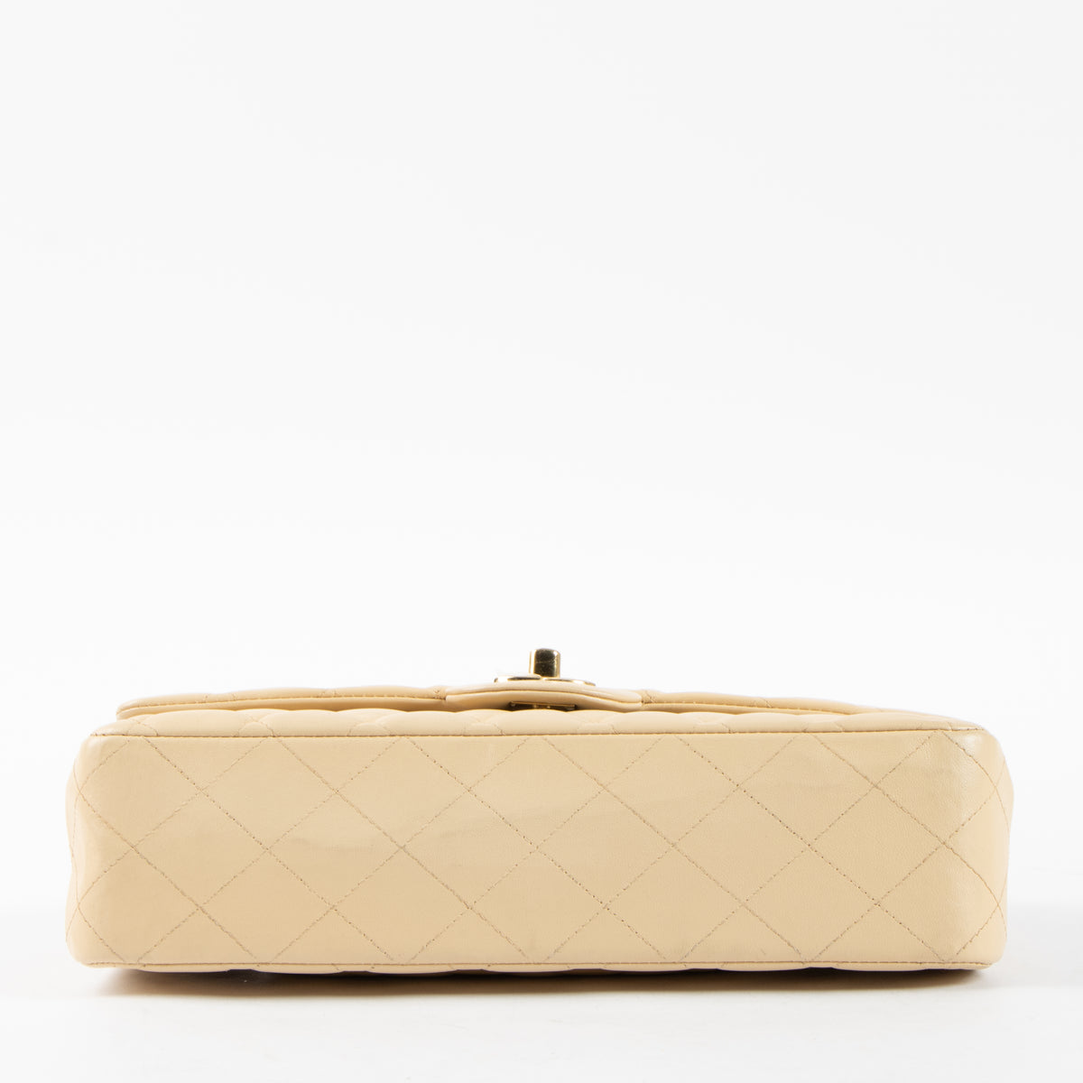 Shop this authentic Chanel Beige Lambskin Medium Classic 11.12 Handbag pre-loved on Labellov.com