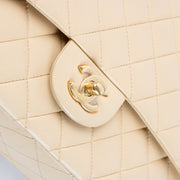 Shop this authentic Chanel Beige Lambskin Medium Classic 11.12 Handbag pre-loved on Labellov.com