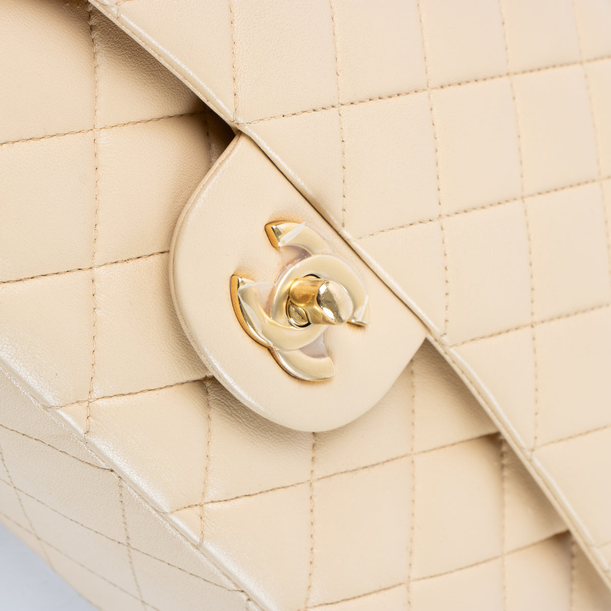 Shop this authentic Chanel Beige Lambskin Medium Classic 11.12 Handbag pre-loved on Labellov.com