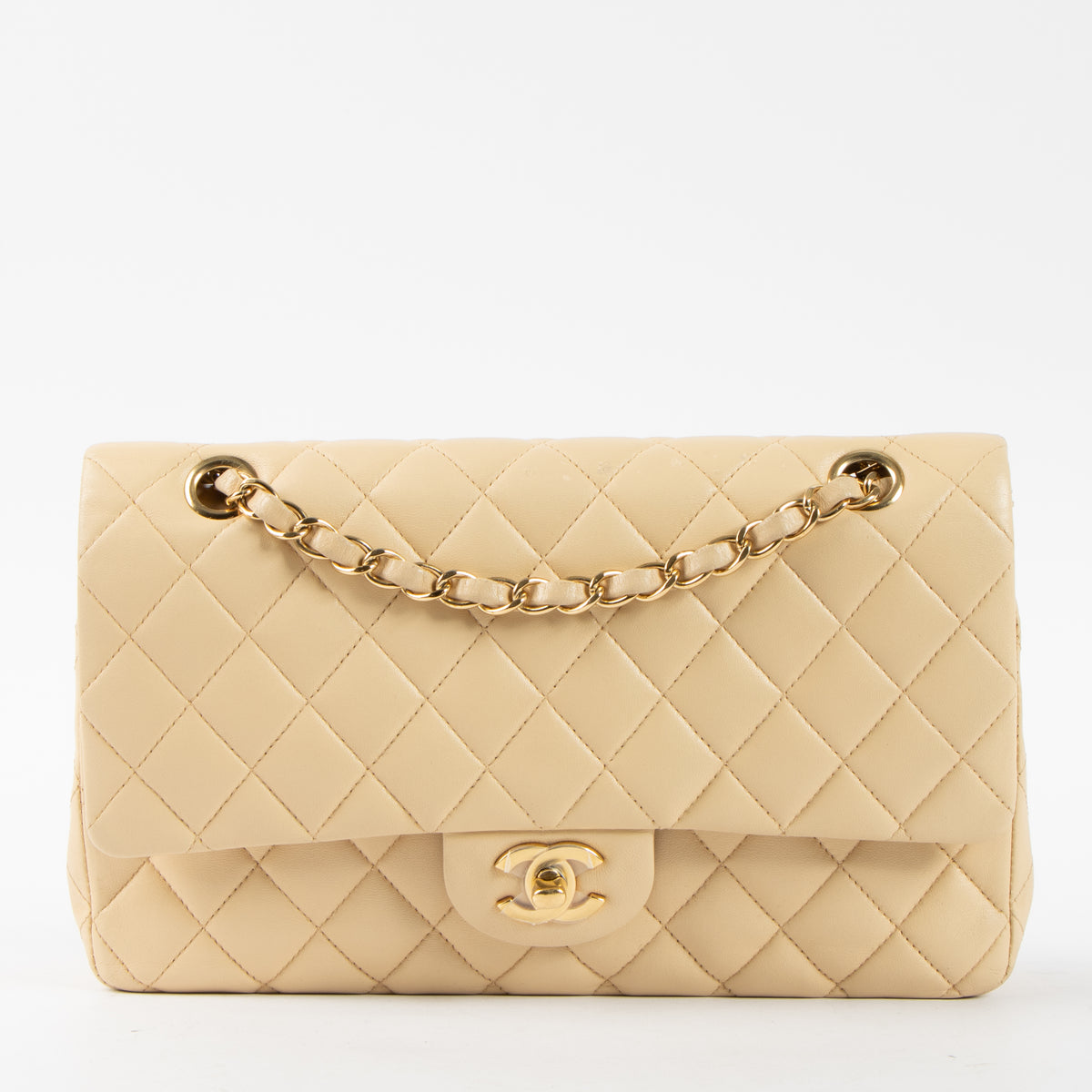 Shop this authentic Chanel Beige Lambskin Medium Classic 11.12 Handbag pre-loved on Labellov.com