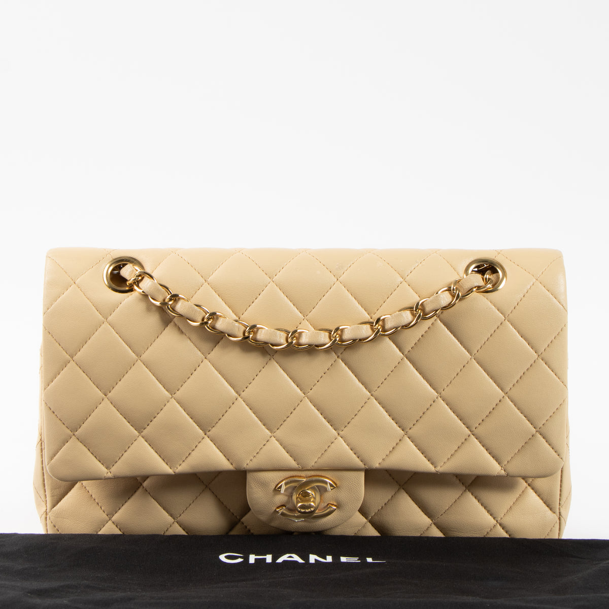 Shop this authentic Chanel Beige Lambskin Medium Classic 11.12 Handbag pre-loved on Labellov.com