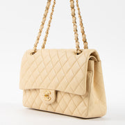 Shop this authentic Chanel Beige Lambskin Medium Classic 11.12 Handbag pre-loved on Labellov.com