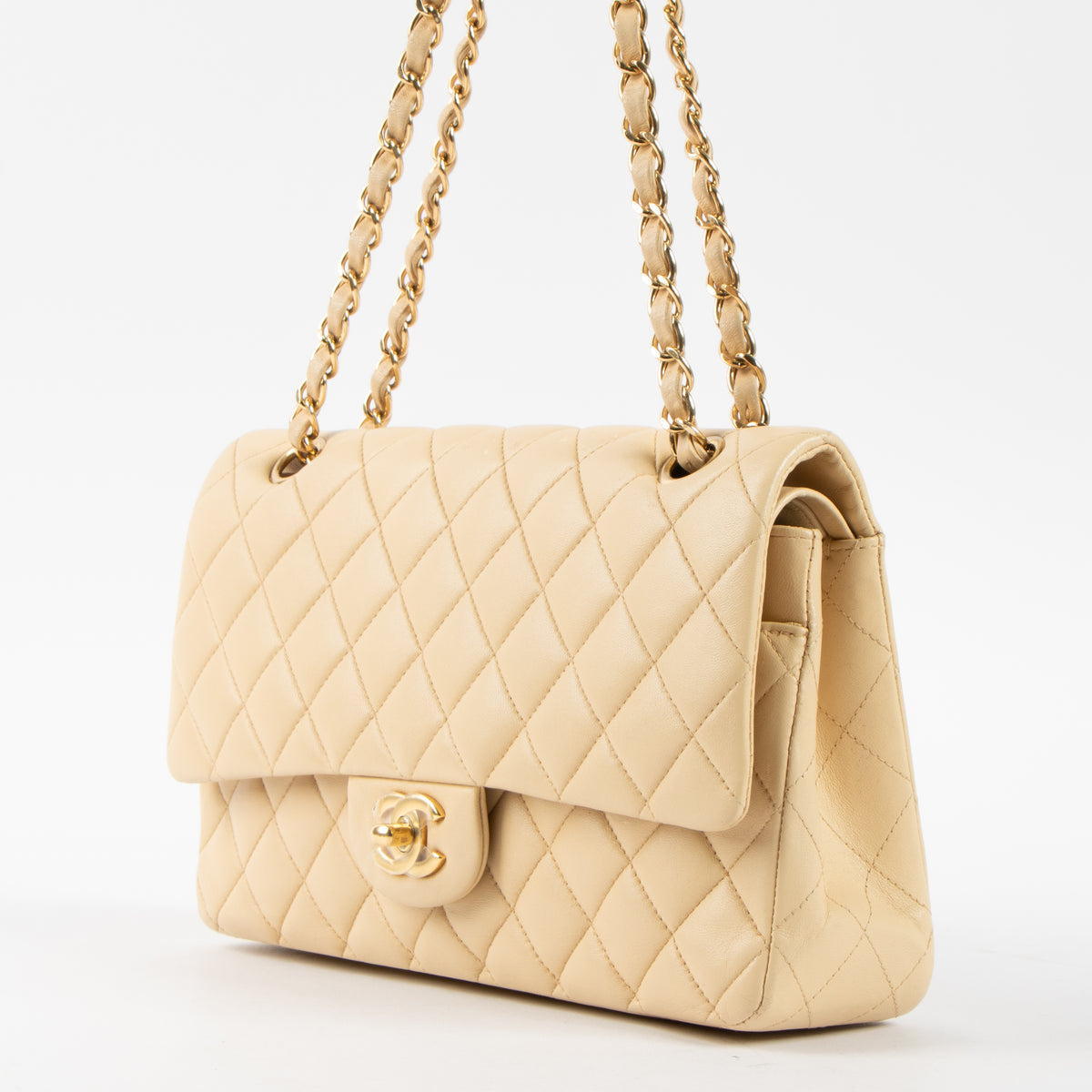 Shop this authentic Chanel Beige Lambskin Medium Classic 11.12 Handbag pre-loved on Labellov.com