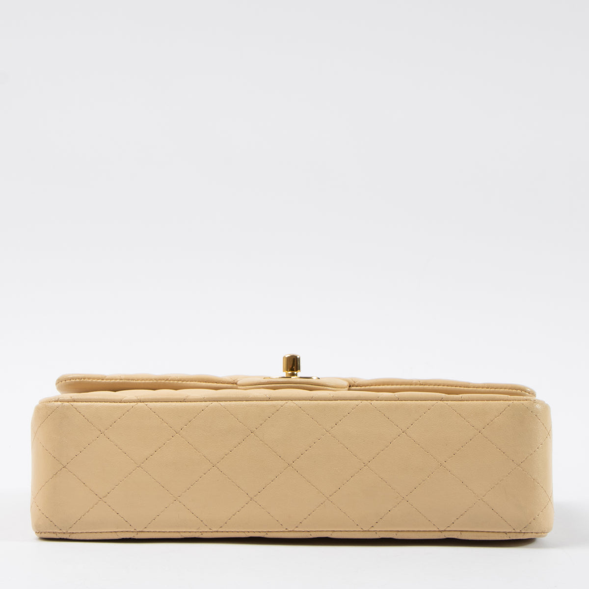 Shop this authentic Chanel Beige Lambskin Medium Classic 11.12 Handbag pre-loved on Labellov.com
