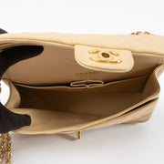 Shop this authentic Chanel Beige Lambskin Medium Classic 11.12 Handbag pre-loved on Labellov.com