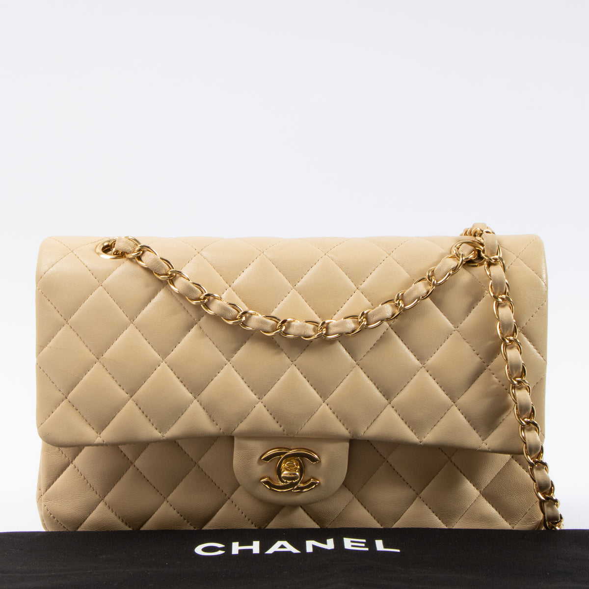 Shop this authentic Chanel Beige Lambskin Medium Classic 11.12 Handbag pre-loved on Labellov.com