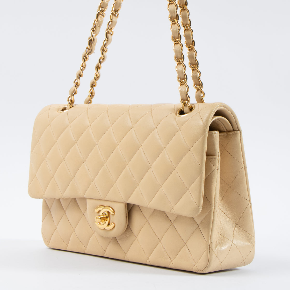 Shop this authentic Chanel Beige Lambskin Medium Classic 11.12 Handbag pre-loved on Labellov.com