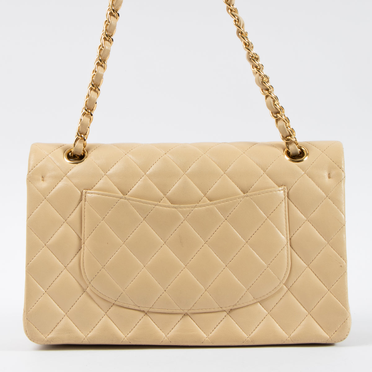 Shop this authentic Chanel Beige Lambskin Medium Classic 11.12 Handbag pre-loved on Labellov.com