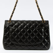 Shop this authentic Chanel Black Lambskin Large/Jumbo Classic Handbag pre-loved on Labellov.com 