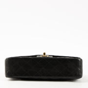 Shop this authentic Chanel Black Lambskin Medium Classic 11.12 Handbag pre-loved on Labellov.com