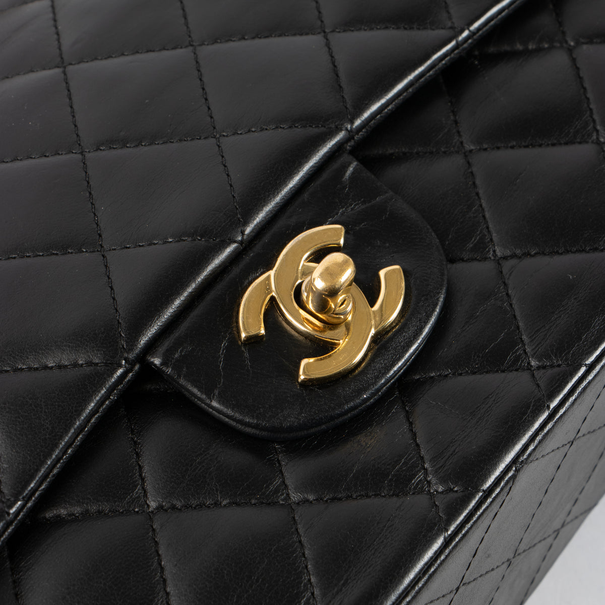 Shop this authentic Chanel Black Lambskin Medium Classic 11.12 Handbag pre-loved on Labellov.com