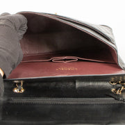 Shop this authentic Chanel Black Lambskin Medium Classic 11.12 Handbag pre-loved on Labellov.com