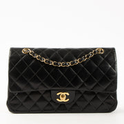 Shop this authentic Chanel Black Lambskin Medium Classic 11.12 Handbag pre-loved on Labellov.com
