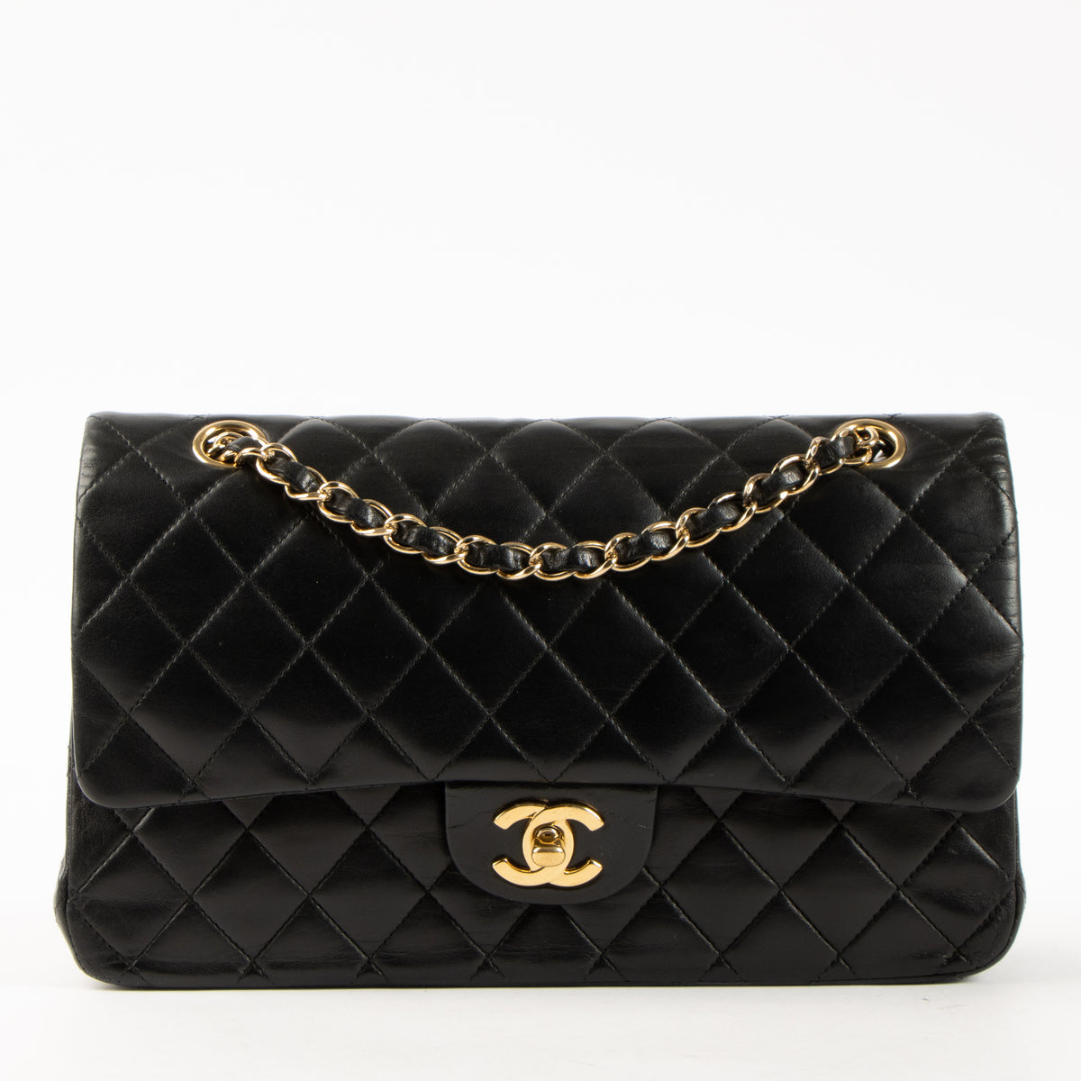 Shop this authentic Chanel Black Lambskin Medium Classic 11.12 Handbag pre-loved on Labellov.com