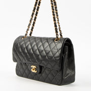 Shop this authentic Chanel Black Lambskin Medium Classic 11.12 Handbag pre-loved on Labellov.com
