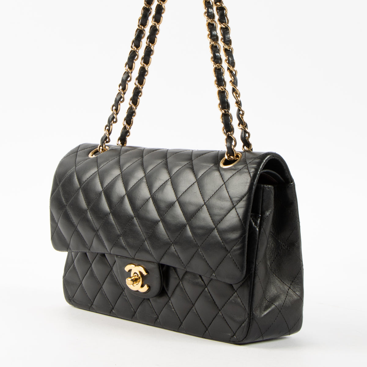 Shop this authentic Chanel Black Lambskin Medium Classic 11.12 Handbag pre-loved on Labellov.com