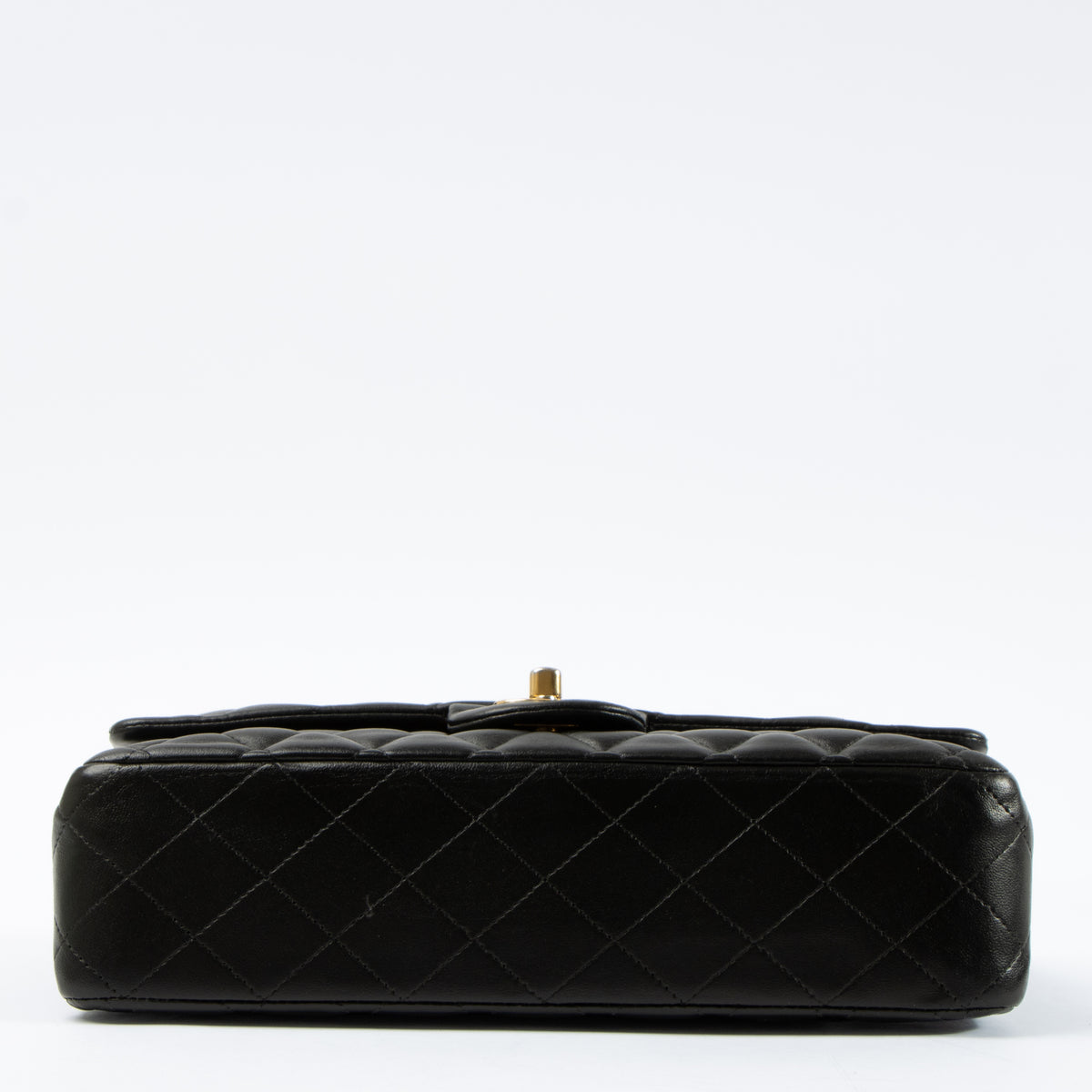 Shop this authentic Chanel Black Lambskin Medium Classic 11.12 Handbag pre-loved on Labellov.com 
