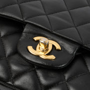 Shop this authentic Chanel Black Lambskin Medium Classic 11.12 Handbag pre-loved on Labellov.com 