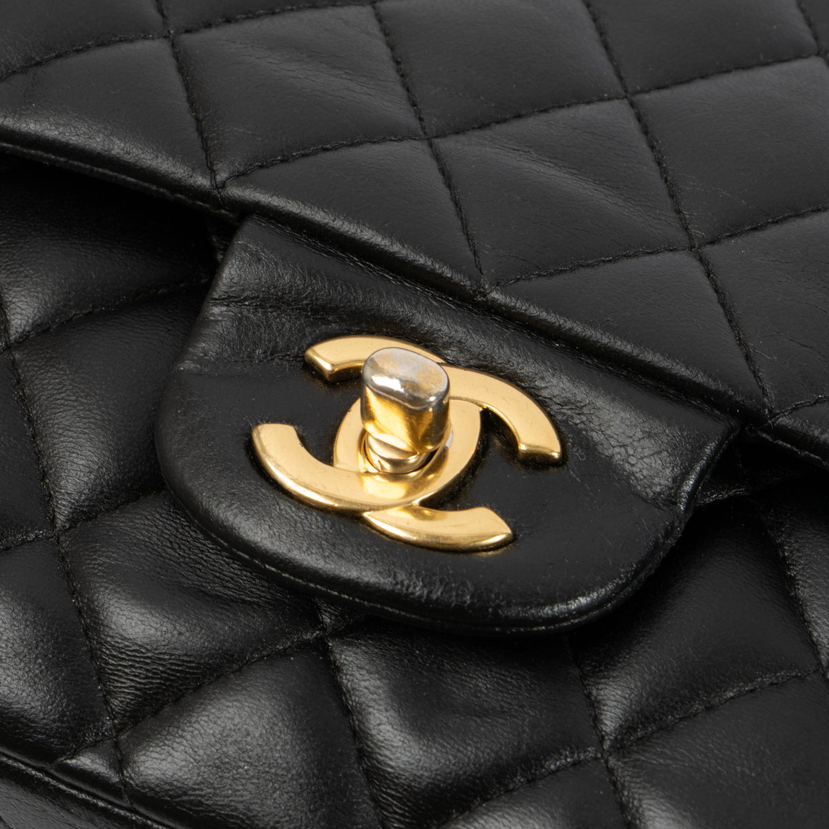 Shop this authentic Chanel Black Lambskin Medium Classic 11.12 Handbag pre-loved on Labellov.com 