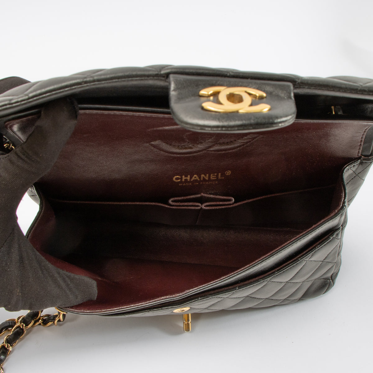 Shop this authentic Chanel Black Lambskin Medium Classic 11.12 Handbag pre-loved on Labellov.com 