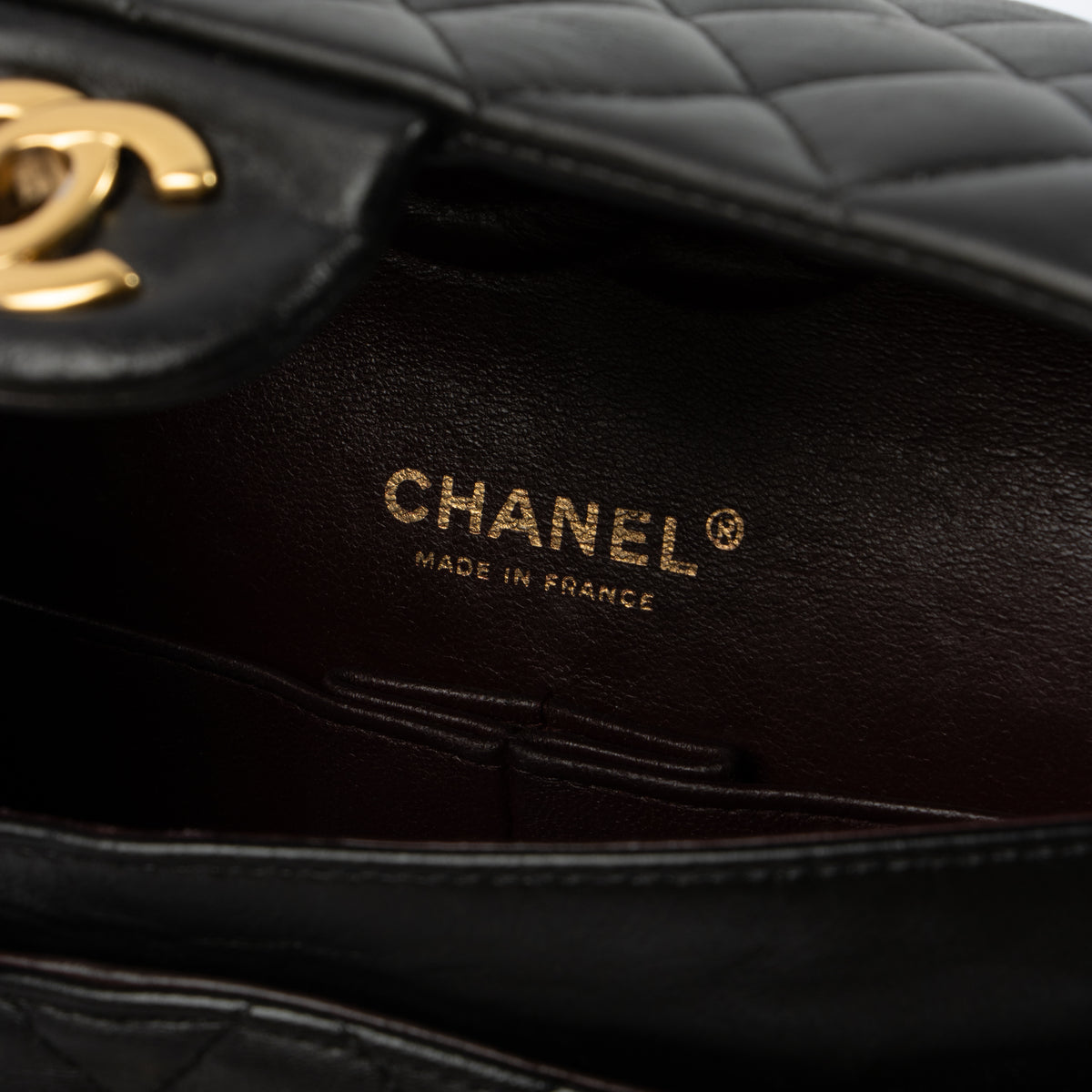 Shop this authentic Chanel Black Lambskin Medium Classic 11.12 Handbag pre-loved on Labellov.com 