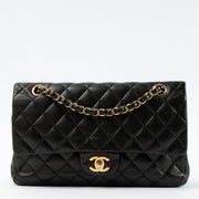 Shop this authentic Chanel Black Lambskin Medium Classic 11.12 Handbag pre-loved on Labellov.com 