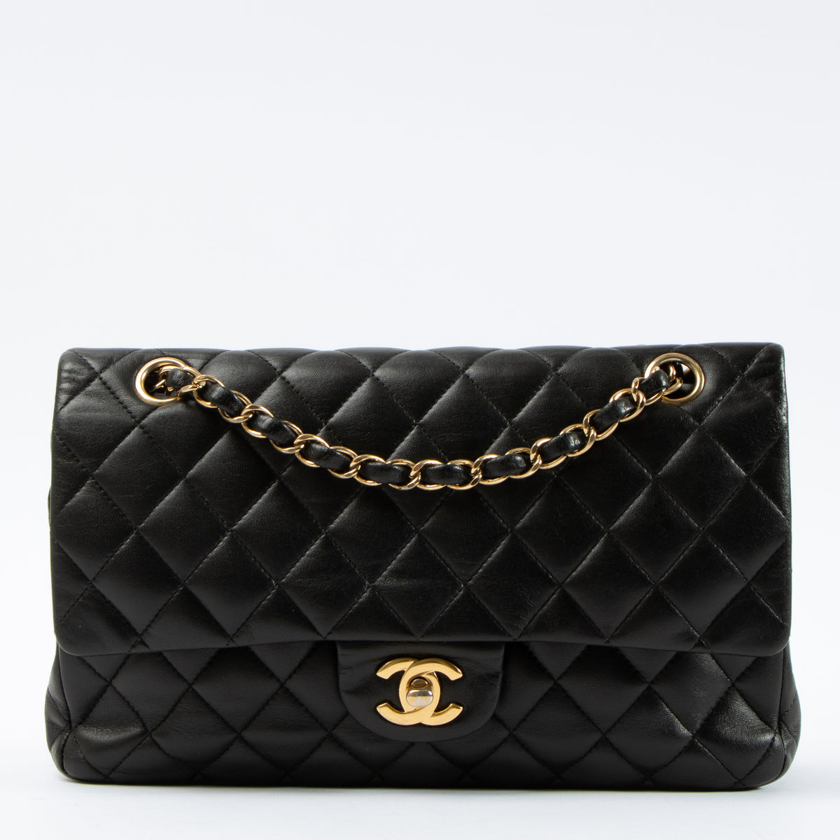 Shop this authentic Chanel Black Lambskin Medium Classic 11.12 Handbag pre-loved on Labellov.com 