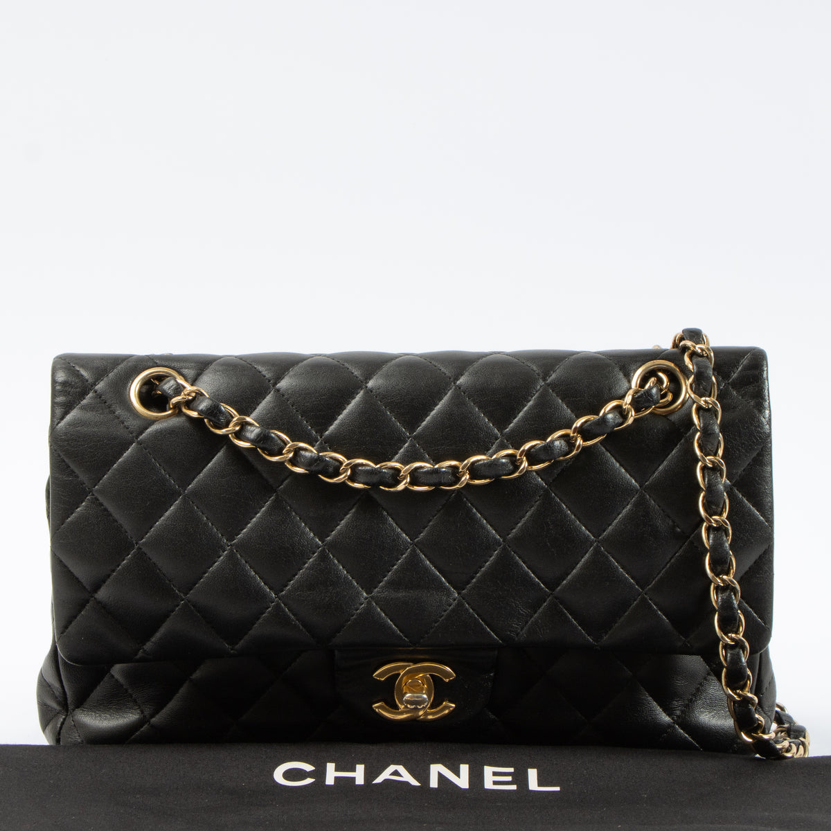 Shop this authentic Chanel Black Lambskin Medium Classic 11.12 Handbag pre-loved on Labellov.com 