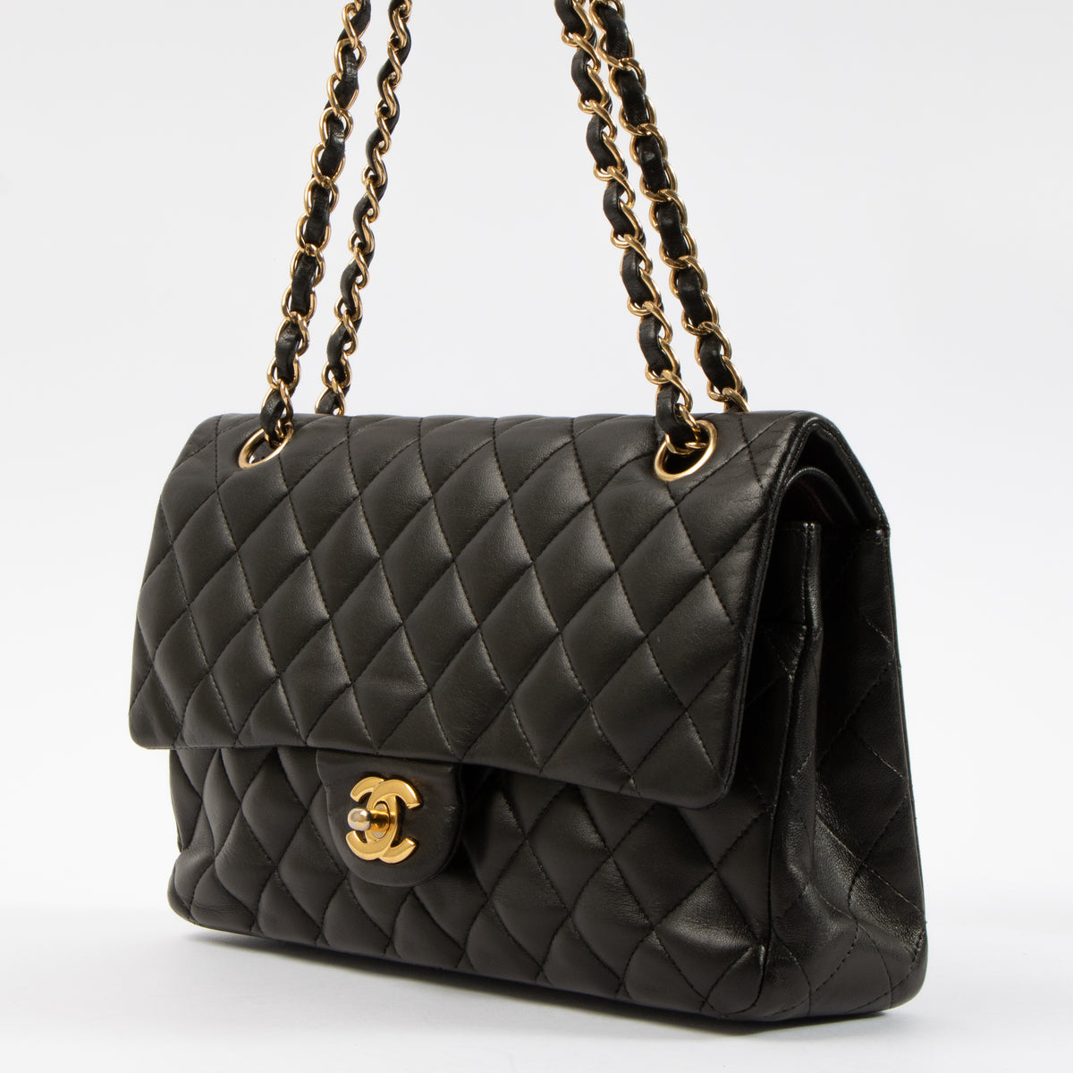 Shop this authentic Chanel Black Lambskin Medium Classic 11.12 Handbag pre-loved on Labellov.com 